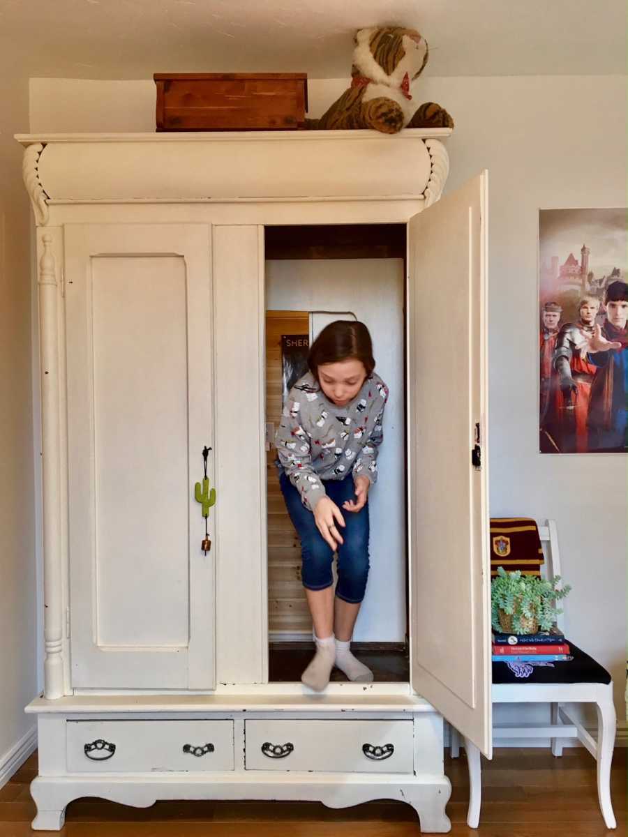 Daughter coming out of closet where there is a secret room her mother made for her
