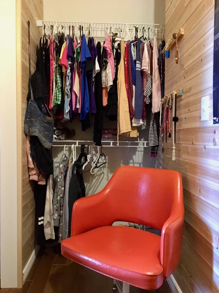 Clothes hanging in girls secret room inside her closet mother made for her