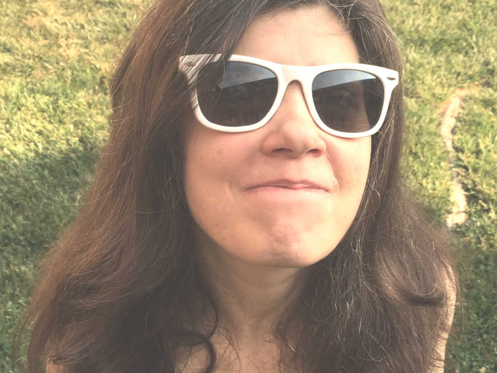 Wife of man who made wine in instant pot smiles with white sunglasses 
