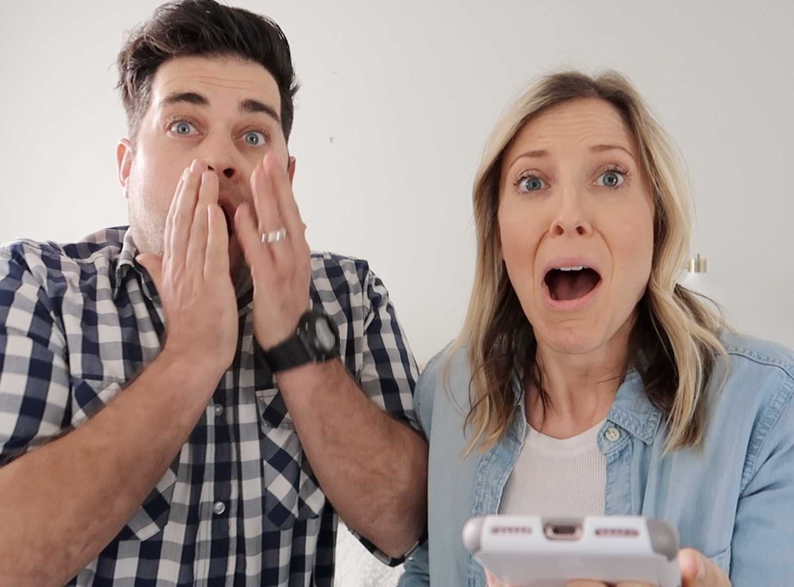 Husband and wife in shock that they are having a baby