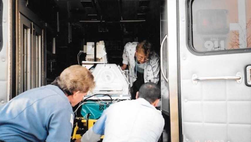 Nurses transporting deceased newborn on ambulance