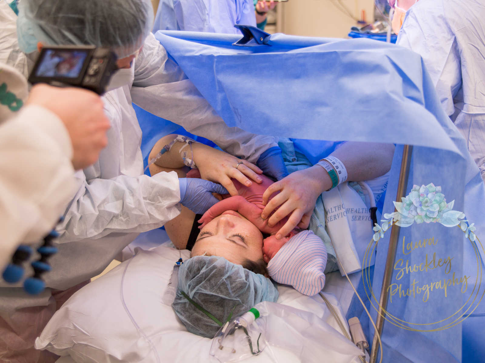 Mother who was in labor for four days holds newborn to her chest