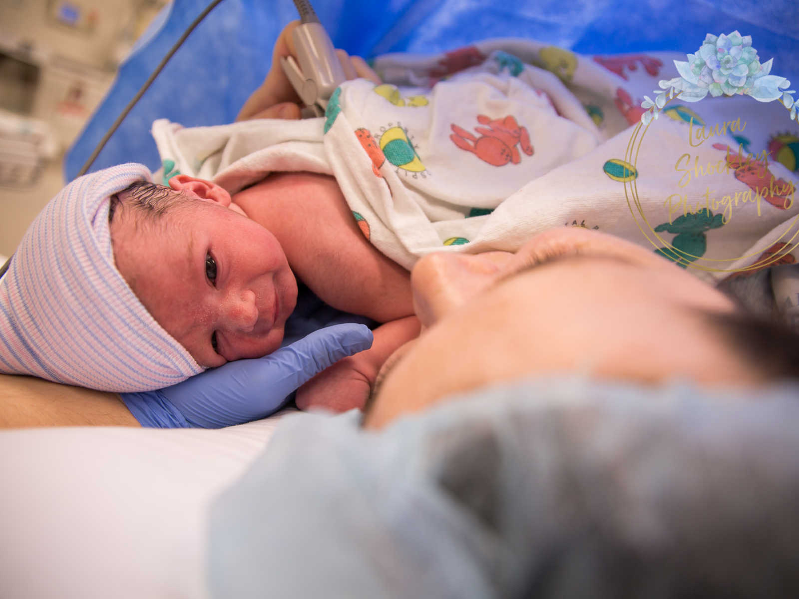 View from mother who was in labor for four days looking down at her newborn