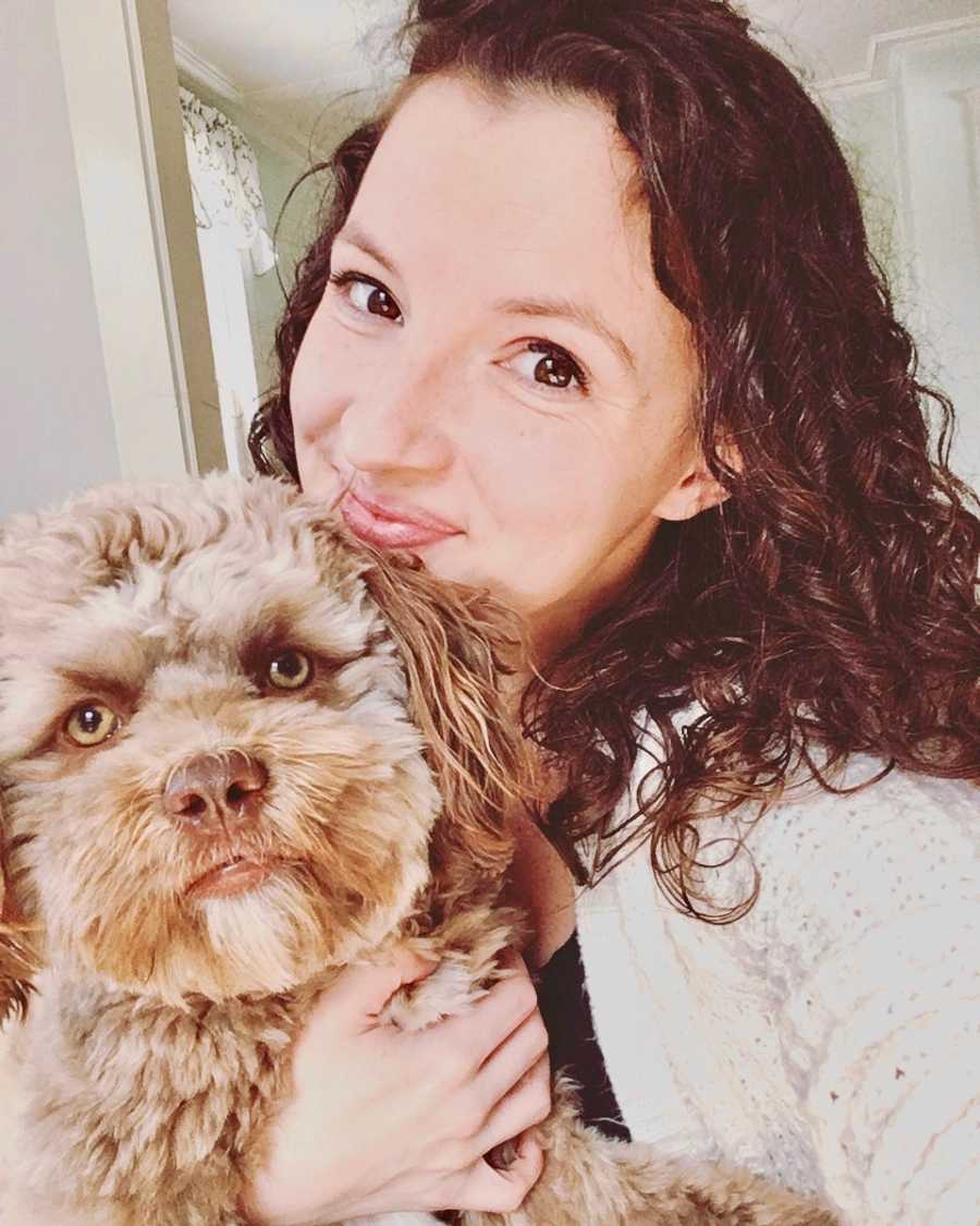 Owner takes selfie with dog who has human-like face