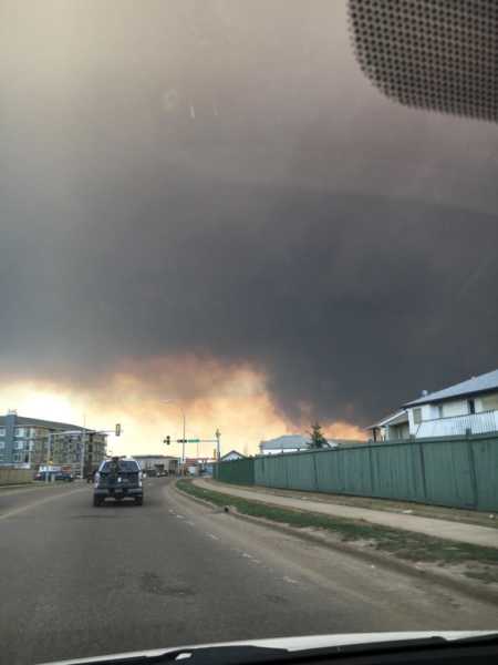 View from car wind shield of wild fires woman's fire fighter husband was fighting