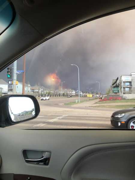View from car window of wild fires woman's fire fighter husband was fighting