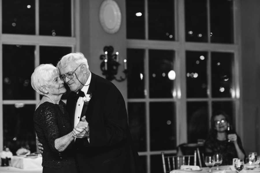 Elderly bride and groom share dance at wedding reception