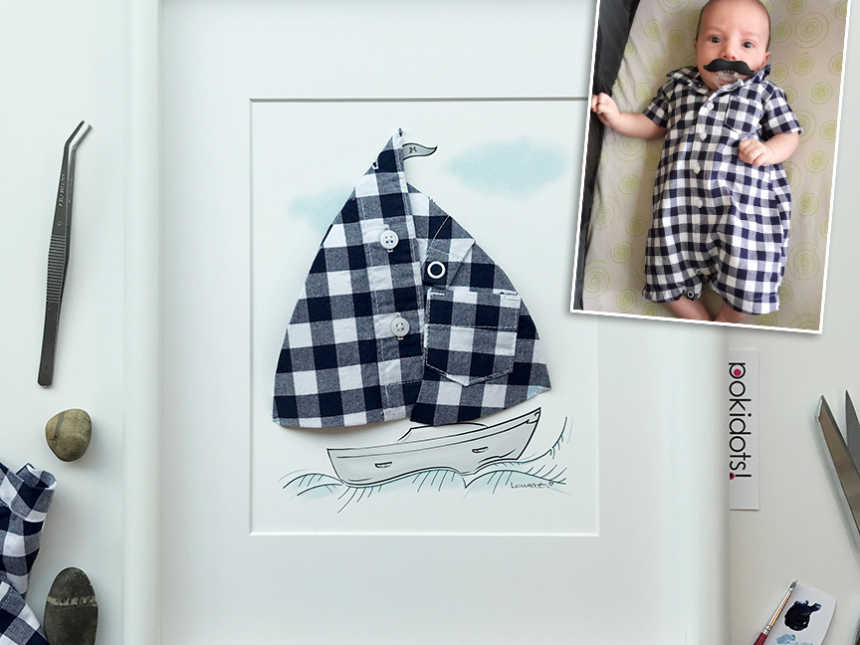 Picture frame of sail boat and sail is made from baby onesie