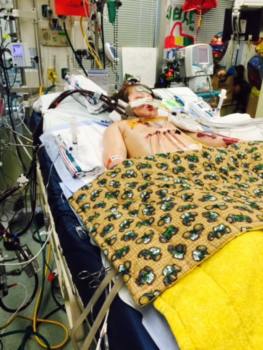 Young boy in hospital bed with wires all over his body due to life threatening strep throat