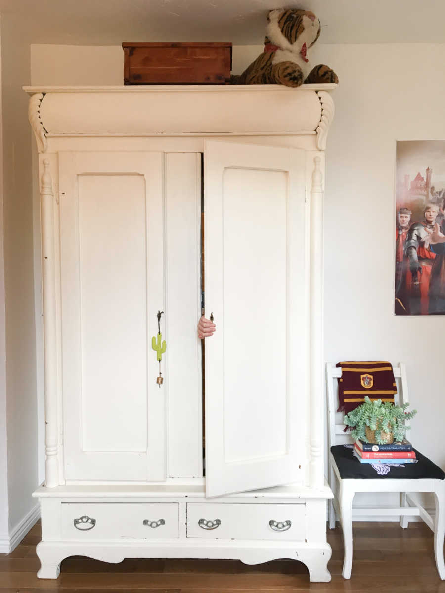 Hand popping out armoire coming out of secret room inside of it mother made for daughter