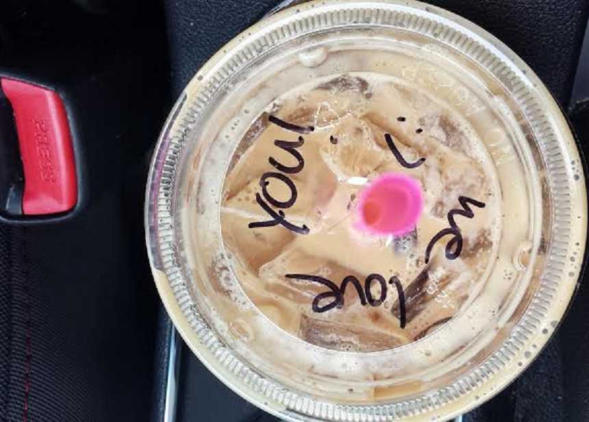 Barista wrote on woman's coffee lid "we love you" when frequent customer looked sad