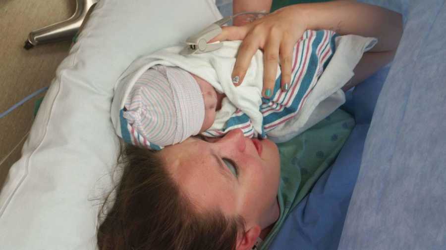 Pregnant woman who was once an addict holds swaddled newborn to chest after birth