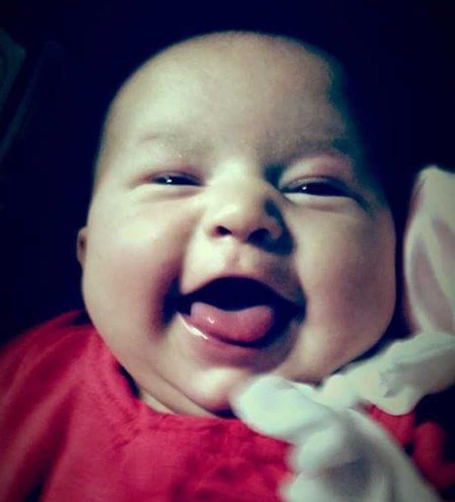 Close up of baby laughing whose mother was once an addict