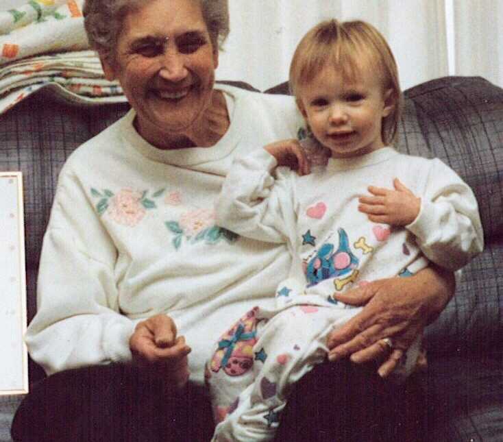 Grandmother who found ring on farm sits with granddaughter on her lap