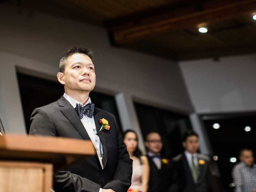 Groom of terminally ill bride smiles at altar