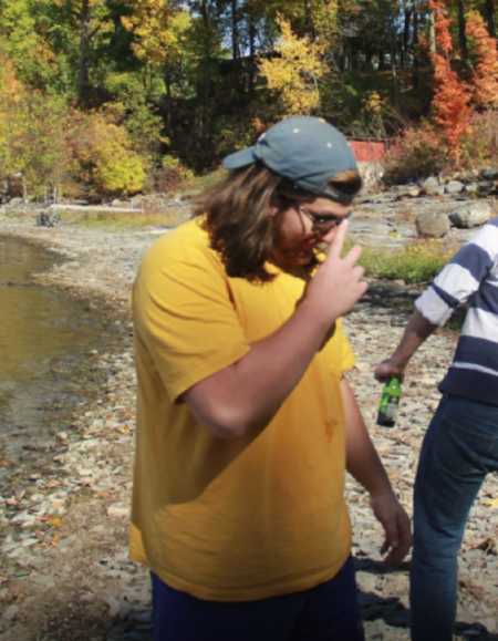 Man before weight loss journey standing beside river