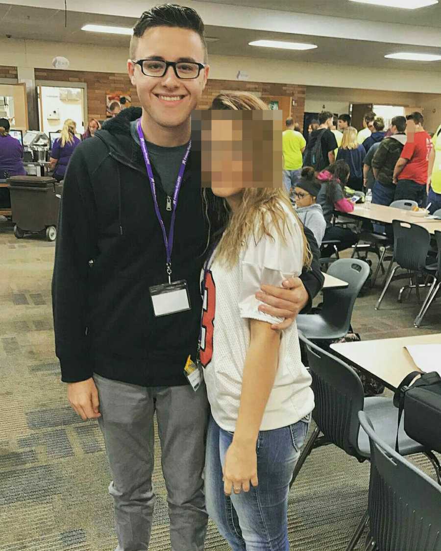 Teen who lost weight smiling with his arm around another teen whose face is blurred out 