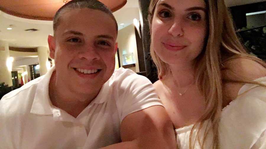 young husband and wife who went through medically induced menopause smile in selfie