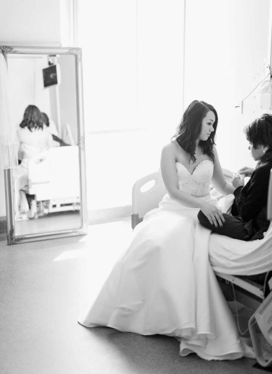 Terminally ill woman sits in hospital bed with daughter in wedding gown 