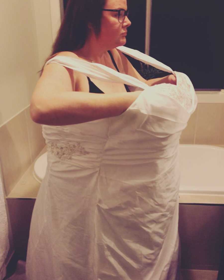 Woman with oversized wedding dress on after she and husband lost combined 400 pounds