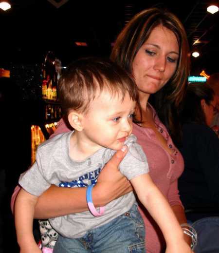 Mother holding on to birth son who she gave up for adoption