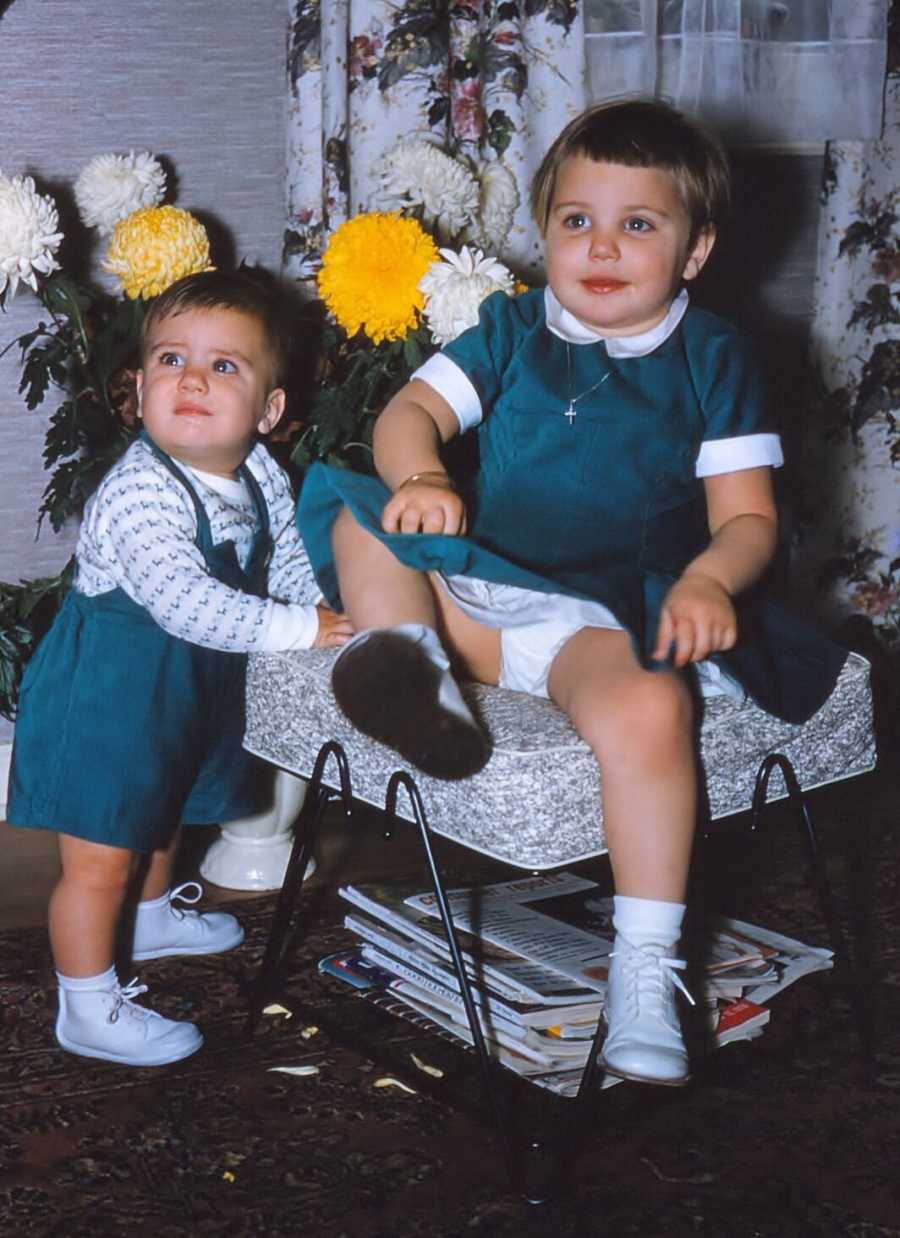 Toddlers wearing green outfits sewed by their mother