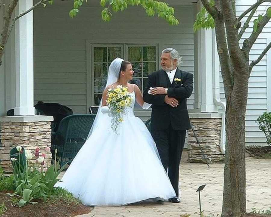 Bride who doesn't have a father walking arm in arm with grandfather