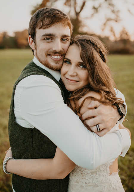 Bride and groom hug after wedding