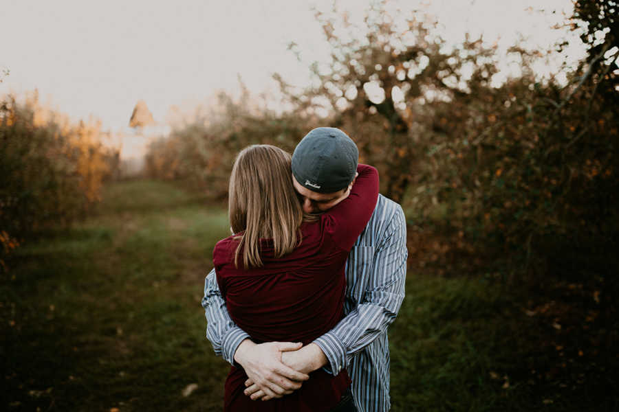 Husband and wife with terminal breast cancer hug