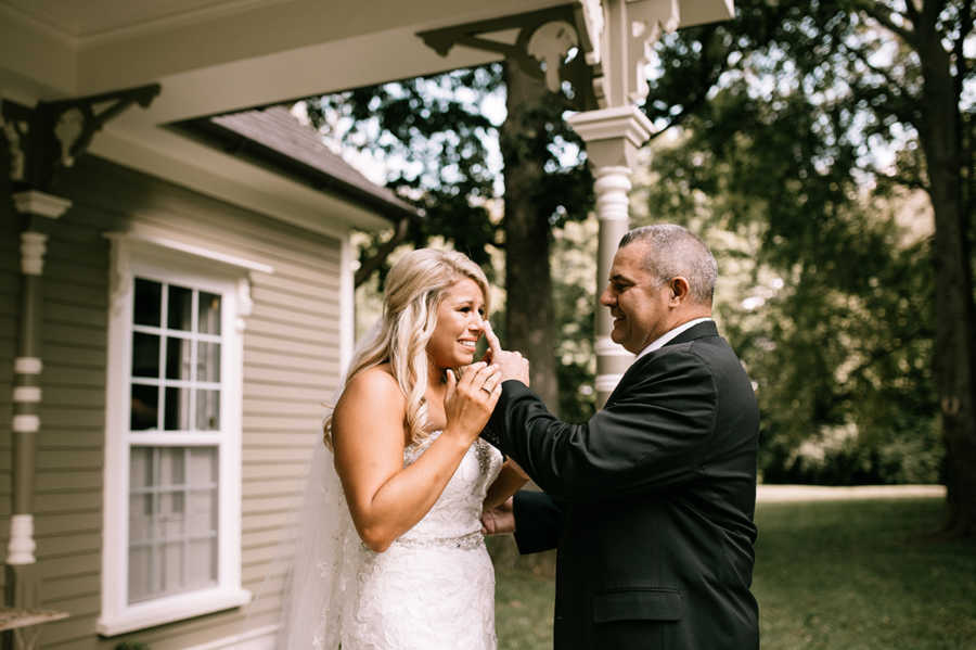 Father of bride wipes away daughters tear
