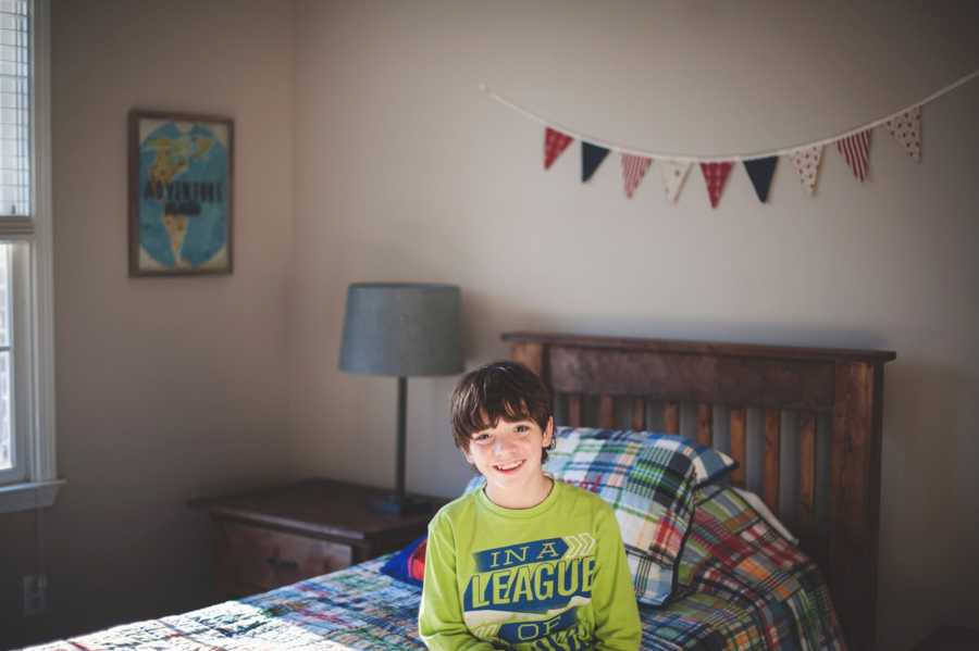 Boy who was adopted by teacher smiles in new bedroom