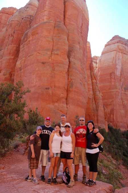 Daughter who was adopted at birth stands with birth mothers family in Arizona