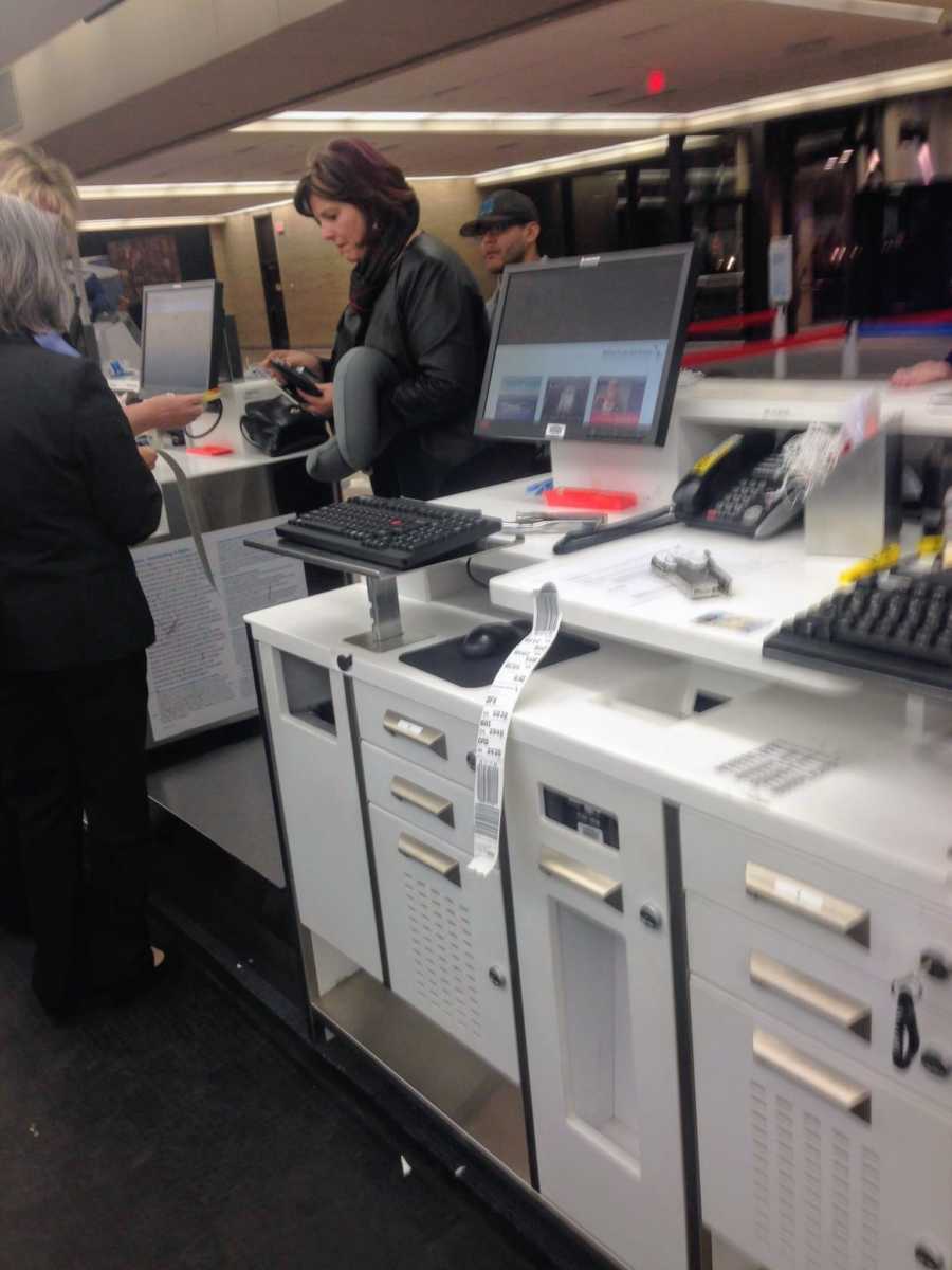 View from behind desk at airport where stranger showed act of kindness to family