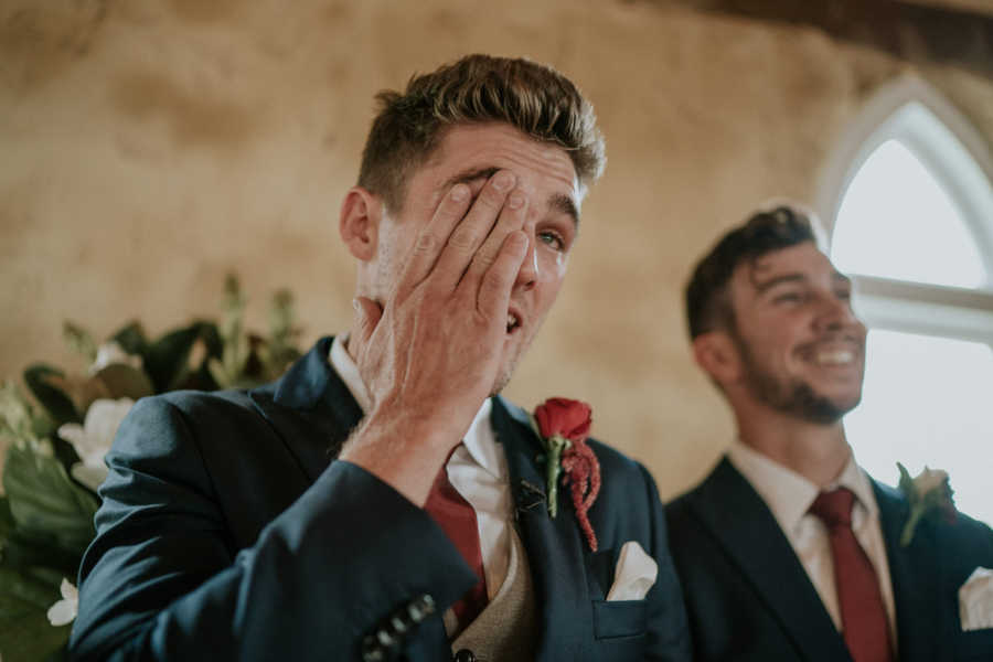 Groom whose father has cancer wipes away tear at altar