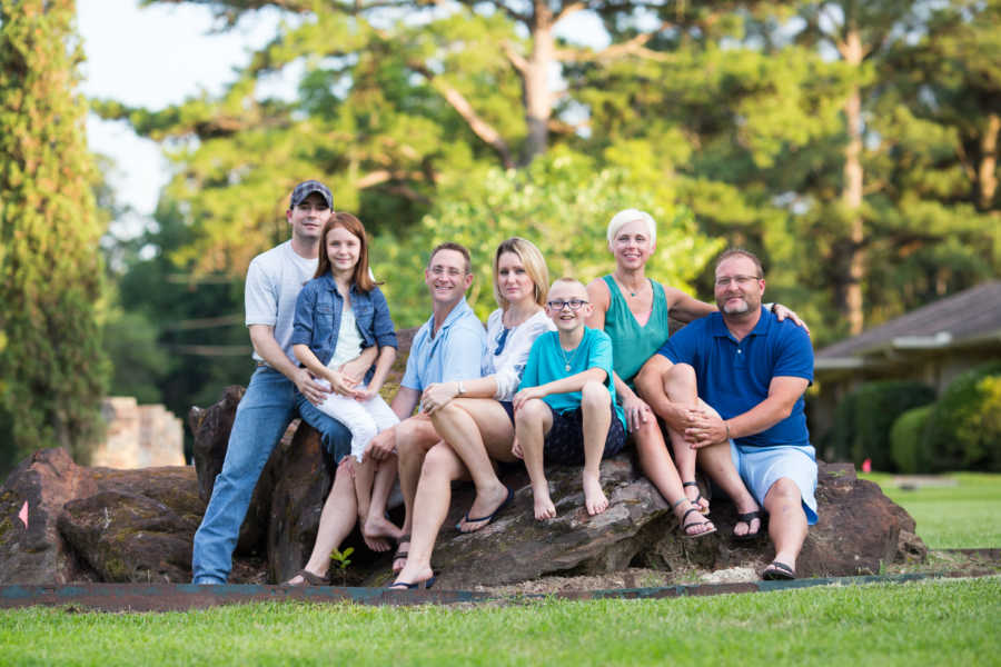 Ex husband and wife sit with their new spouses and two children