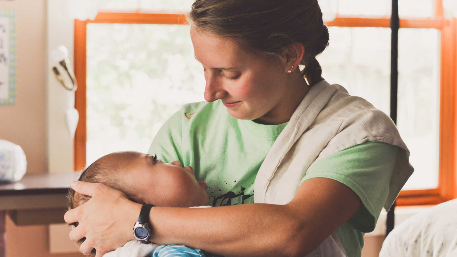 Woman holding young boy who is terminally ill