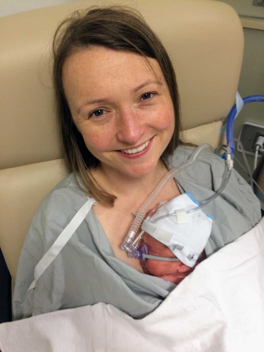 Woman who drank her own breast milk to help fight cancer smiles in chair in hospital