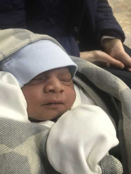 Close up of newborn who was delivered in hotel room
