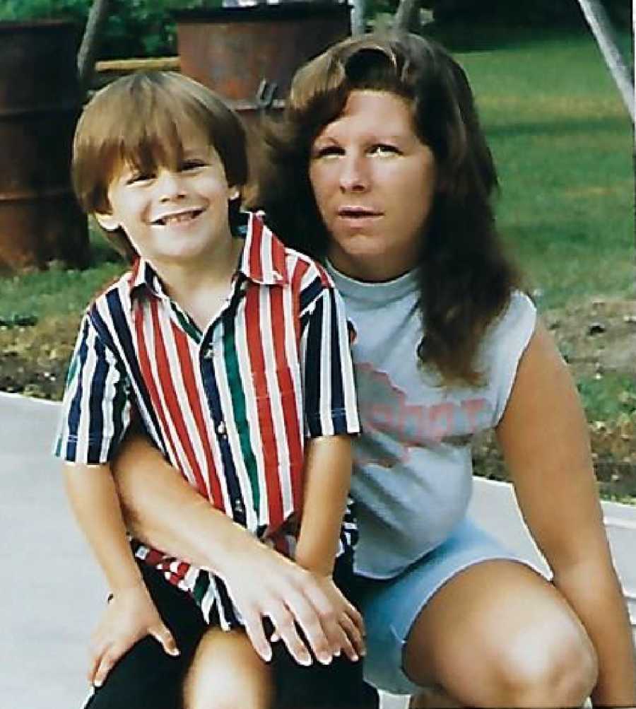 Son who will later in life donate his kidney to his mother sitting on her lap