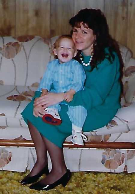 Mother with son who will later in life donate a kidney sitting on her lap