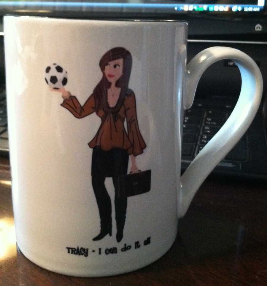 Mug with woman holding briefcase and soccer ball that says, "Tracy- I can do it all"