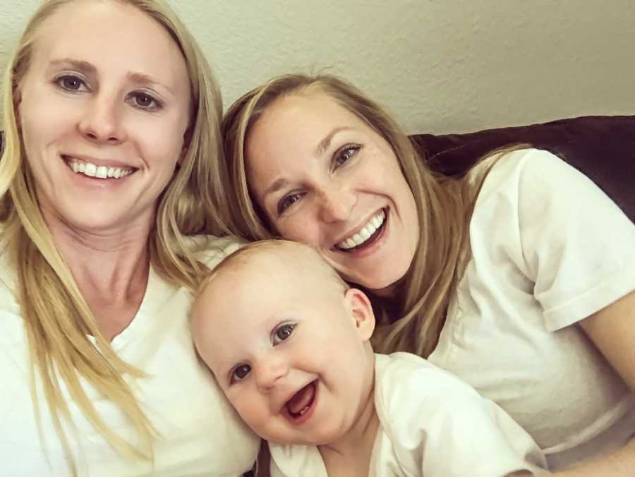Wives smiling in selfie with their baby who was conceived through IVF