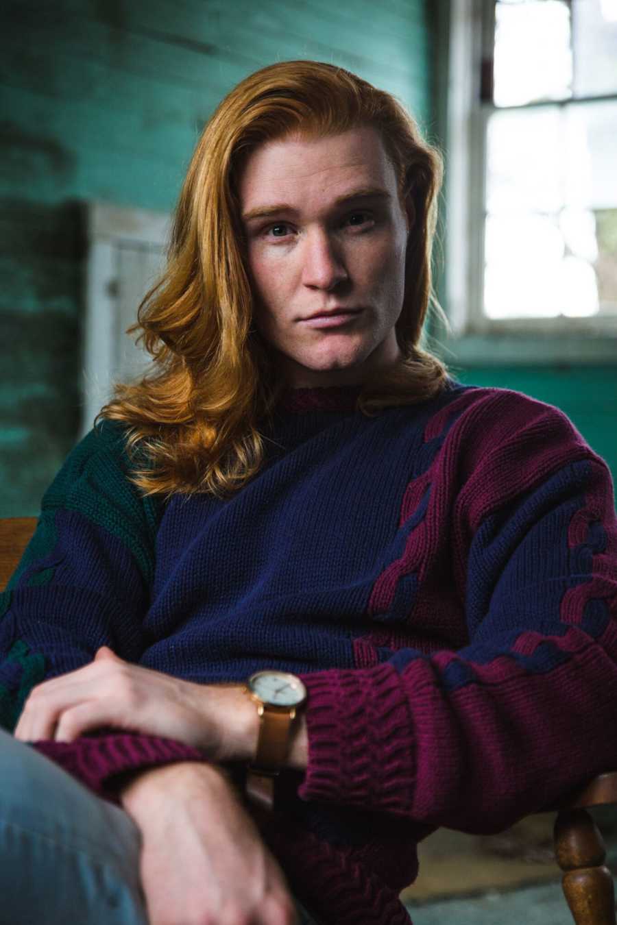 Man who chose exercise to help defeat depression sits in chair with straight face