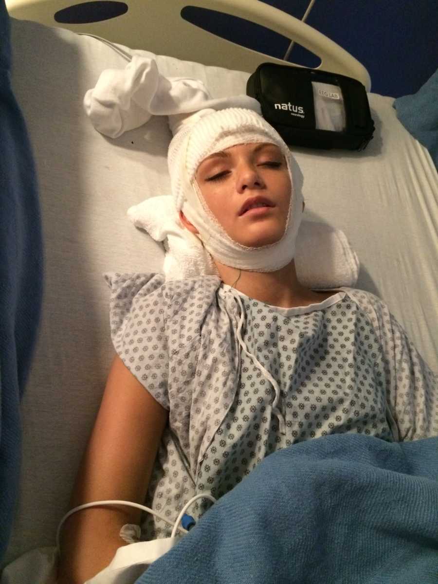 Teen with focal seizures lying in hospital bed with bandages wrapped around her head after brain surgery