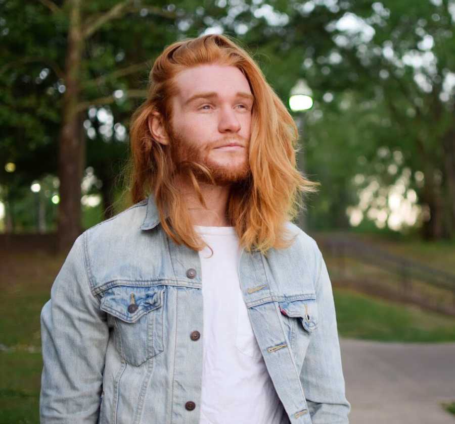 Man who battles with depression but uses fitness as a coping mechanism standing in park