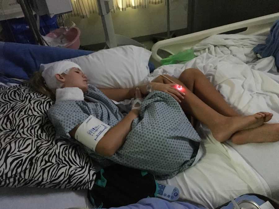 Teen with Focal seizures with loss of consciousness sleeps in hospital bed with bandages wrapped around head