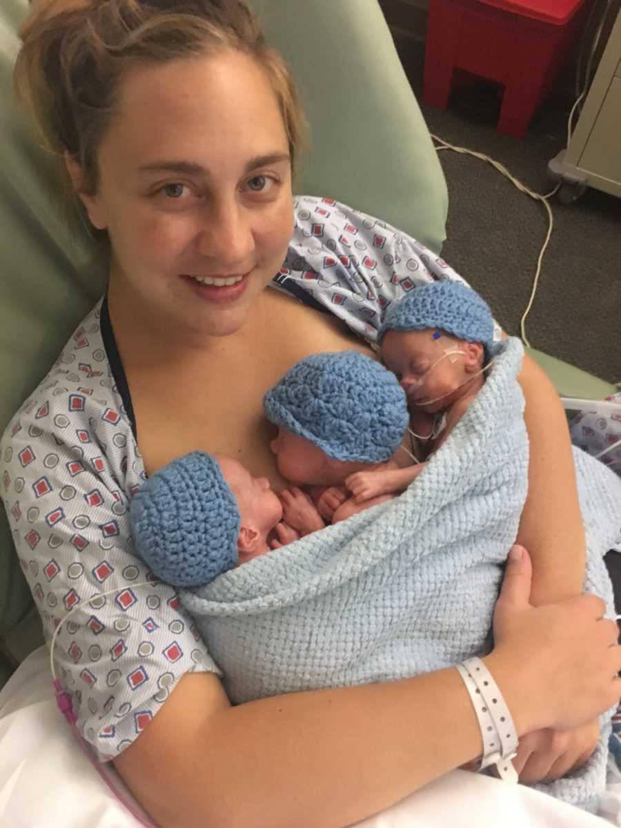 Woman who just gave birth holds triplets to bare chest