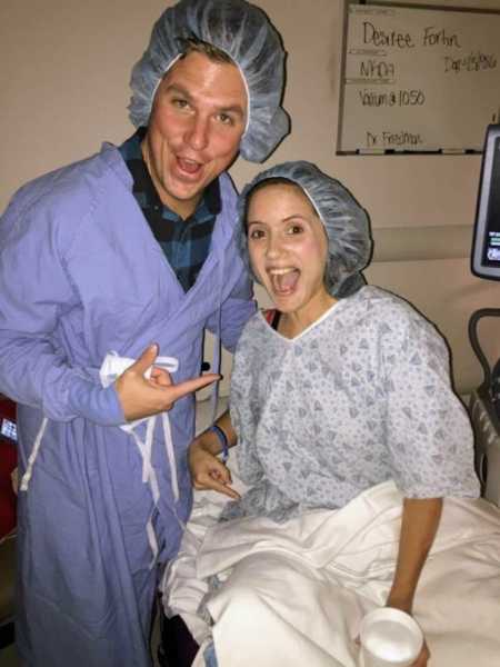 Husband and wife who struggled to get pregnant in scrubs before wife gives birth
