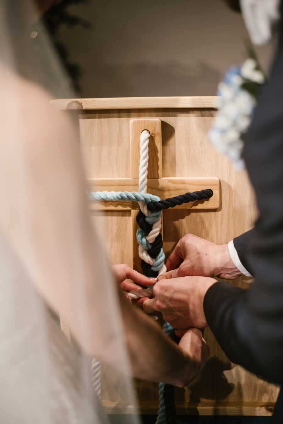 Bride and groom braiding rope at wedding ceremony for religious purposes