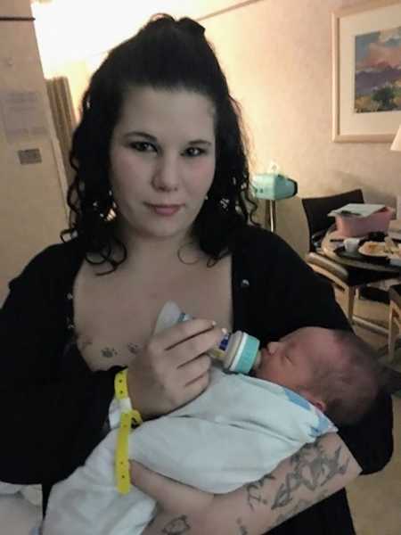 Woman bottle feeds newborn daughter she will put up for adoption